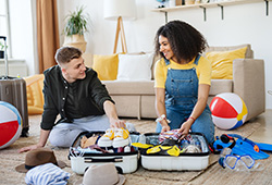 Young couple packing for a Seaside Park rental vacation