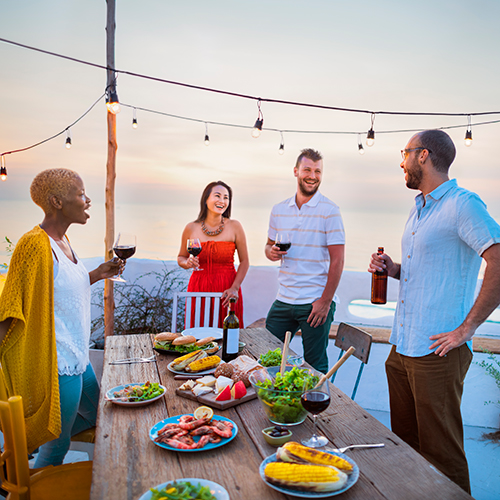 Group of friends enjoying life outside after purchasing a home in the Lavallette real estate market