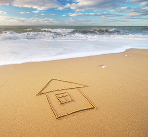 Shape of homes for sale in Seaside Park drawn in the sand by the ocean